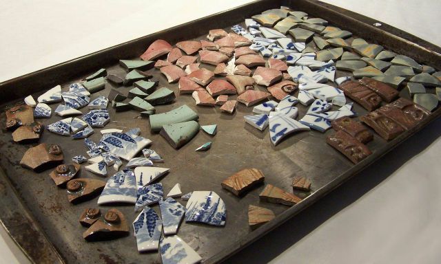 Broken ceramic pieces ready to install on plant pot