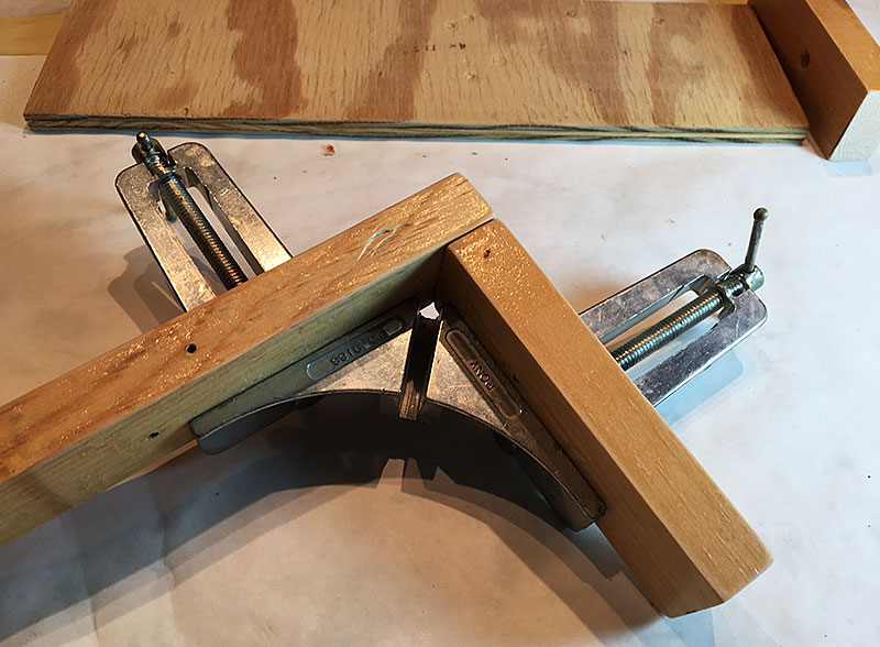Wood pieces in a miter clamp