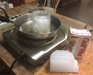 Melting paraffin wax using the double-boiler method